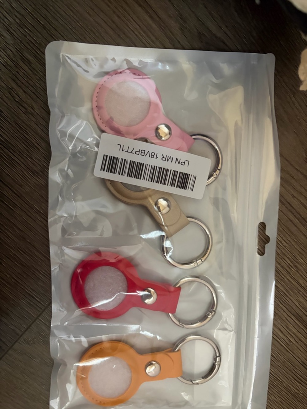 Set of 4 Silicone Airtag Keychain Holders - Pink, Beige, Red, Orange
